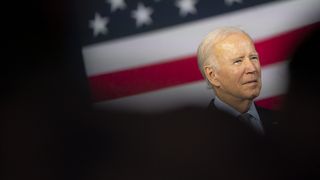Photo of Joe Biden's face among silhouettes